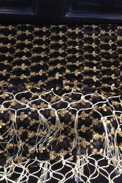Krill work is embroidery on silk chiffon. Light and hand attached fringe black silk with golden floral pattern embroidery